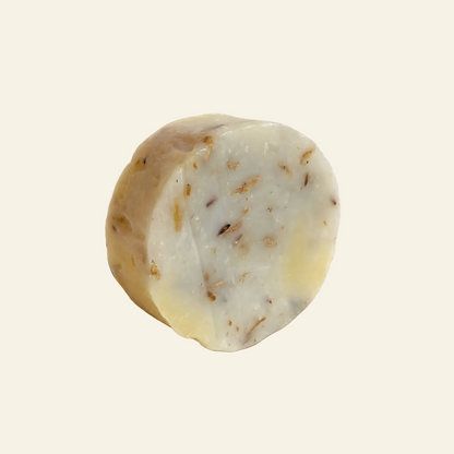 A bar of handmade sleep aid soap labeled &
