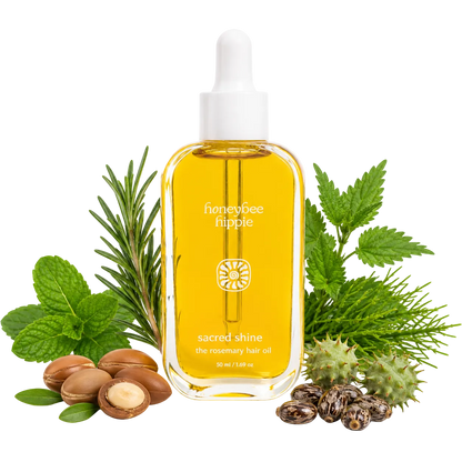 Honeybee Hippie sacred shine hair oil bottle with natural ingredients on a white background