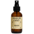 Brown glass bottle with black spray nozzle and &