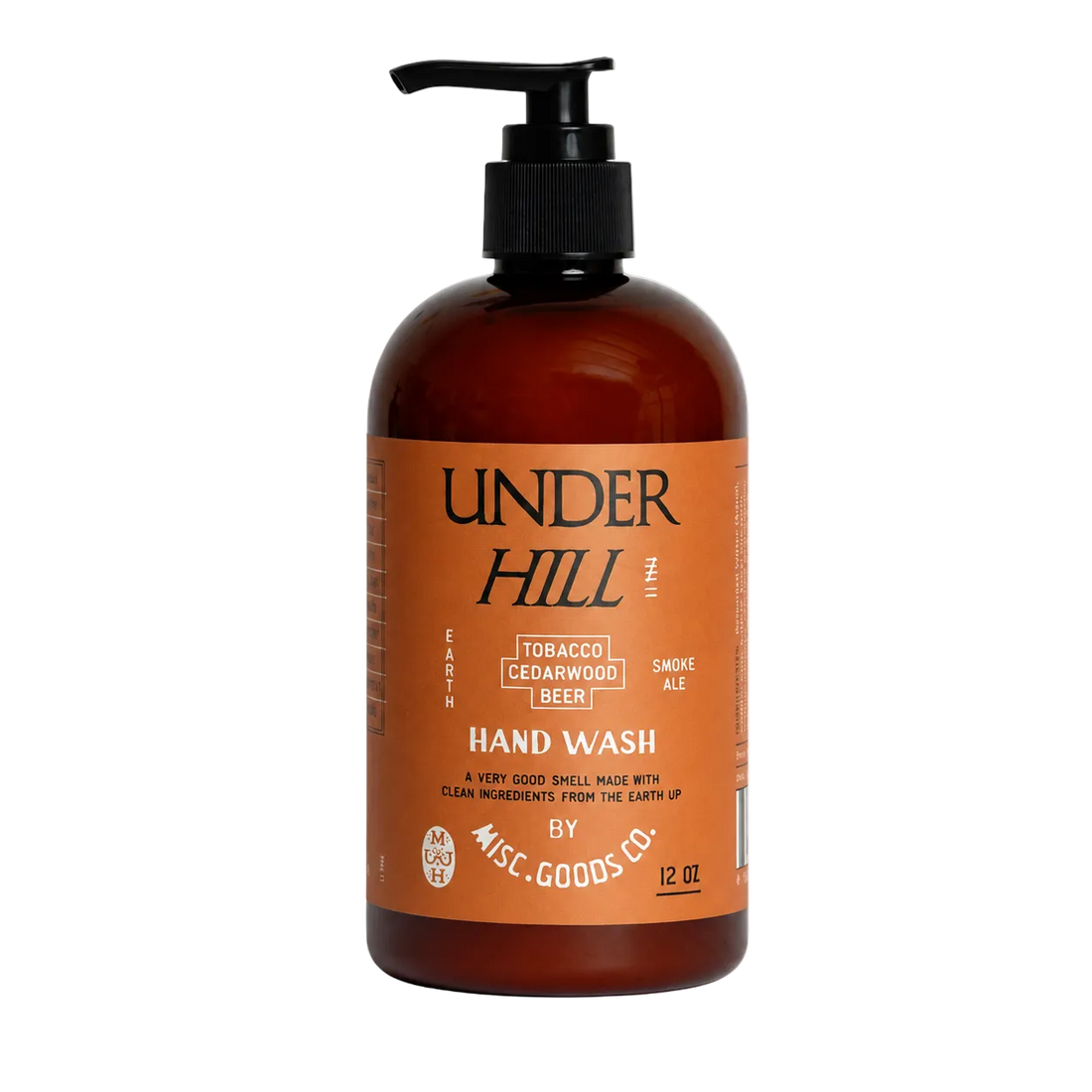 Brown bottle of Under Hill hand wash with pump on a white background