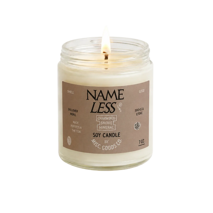 Candle in a glass jar with a label on a white background