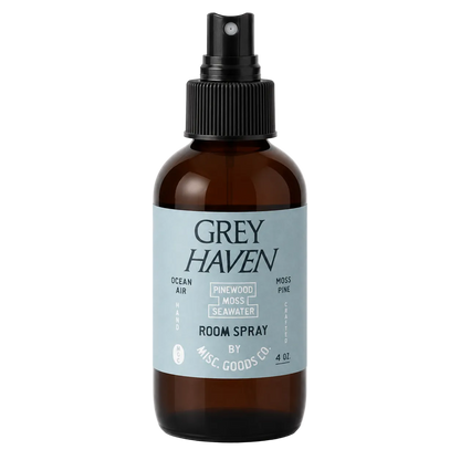 Brown spray bottle with a label for Grey Haven room spray on a white background