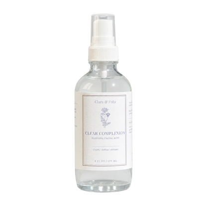 Clear bottle with white cap and label on a light beige background