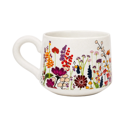 White mug with colorful floral design on a white background