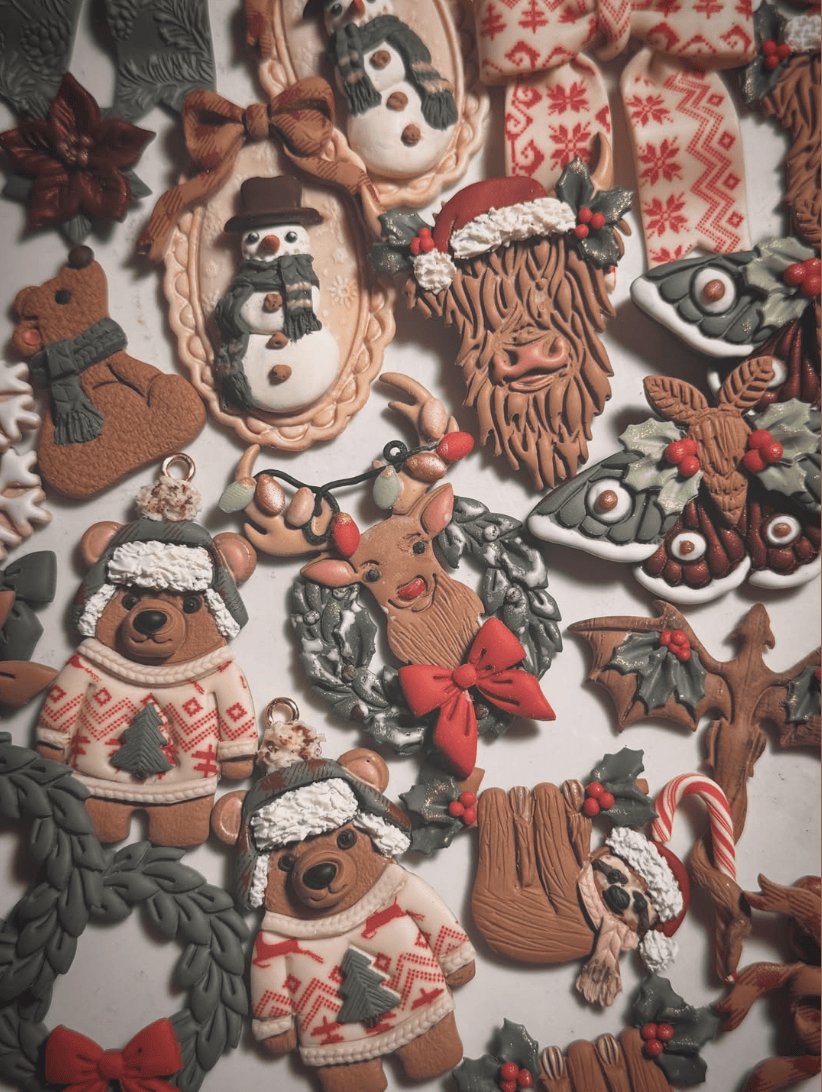 Collection of decorative gingerbread cookies with various Christmas-themed designs on a white background.