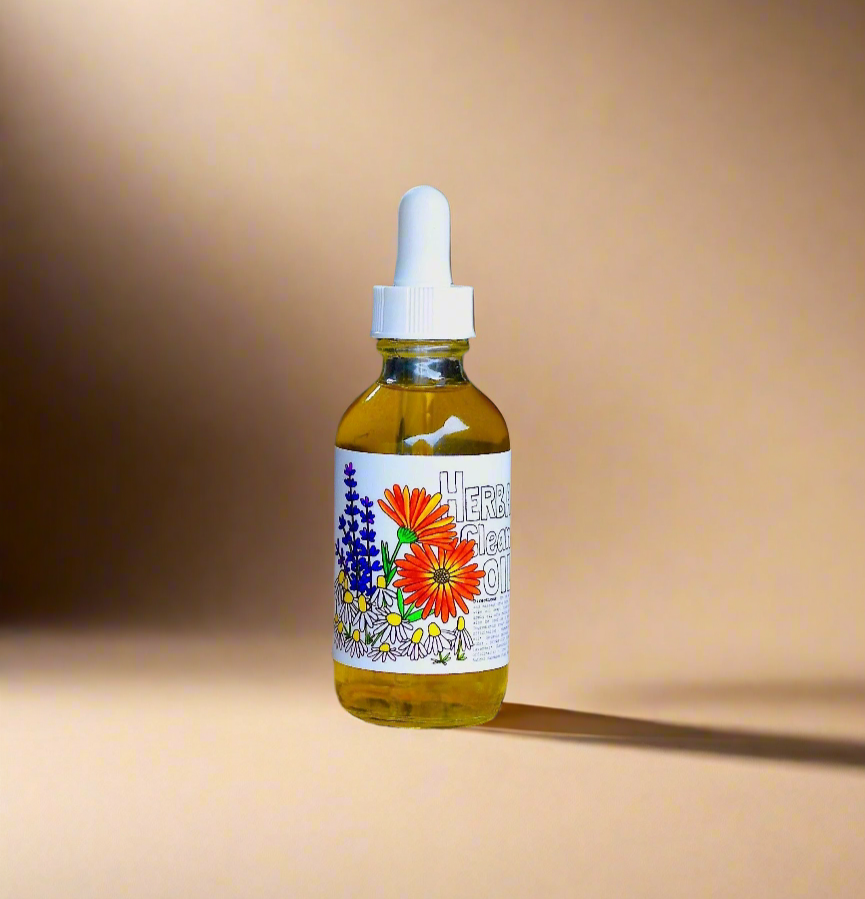 Bottle of herbal tincture with a dropper on a sandy surface