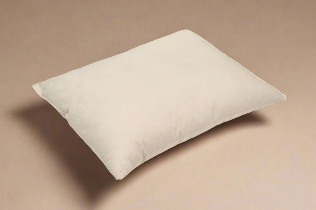 Beige pillow on a light gray background
