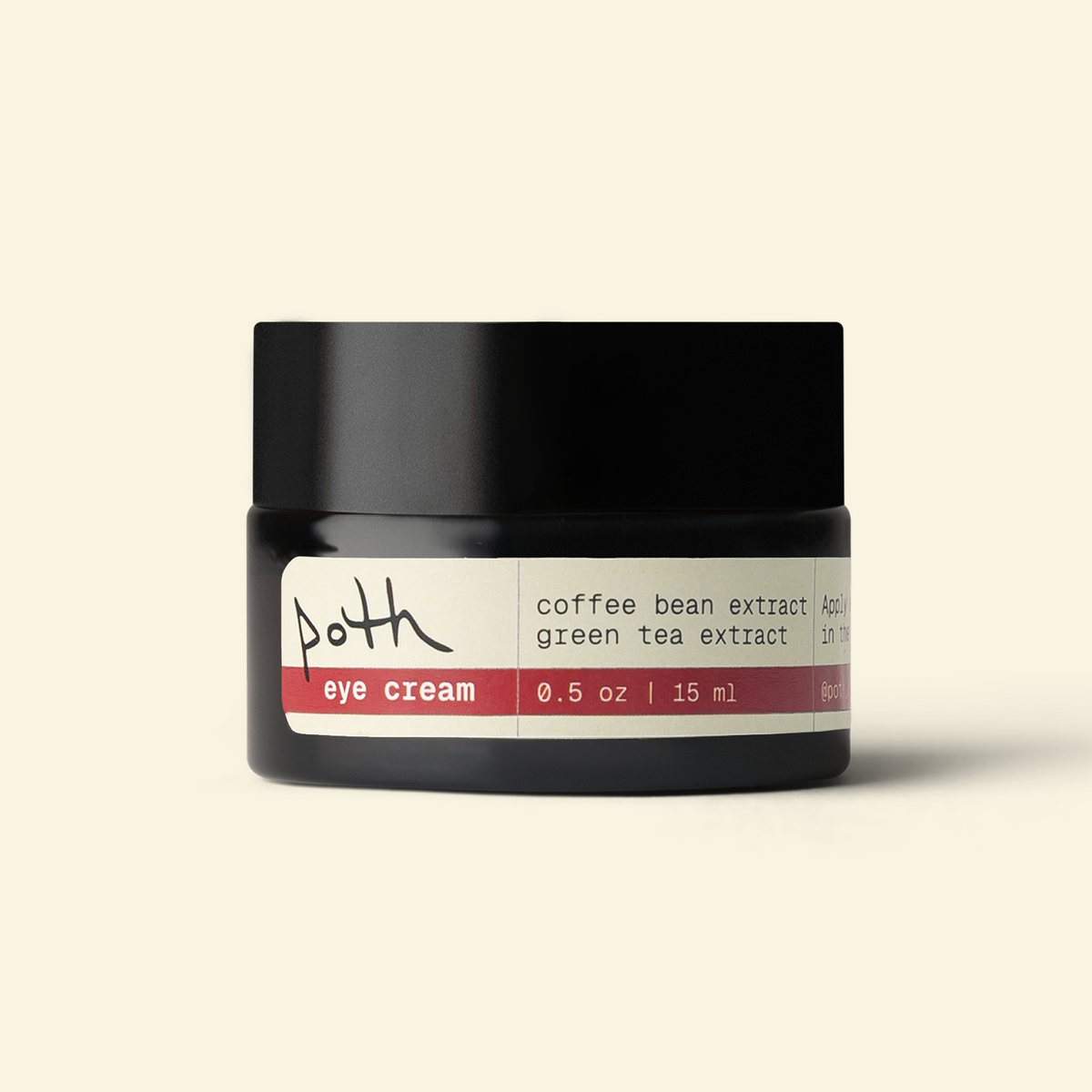 A black jar of Poth Eye Cream on a light beige background. The label is cream-colored with a red stripe and text reading &
