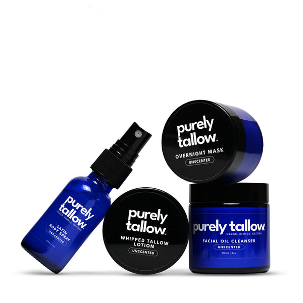 Four Purely Tallow skincare products arranged on a white background: a blue bottle of facial oil cleanser with spray, a blue jar of facial oil cleanser, a black-lidded jar of overnight mask, and a black-lidded bottle of whipped tallow lotion.