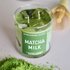 A glass jar candle labeled &