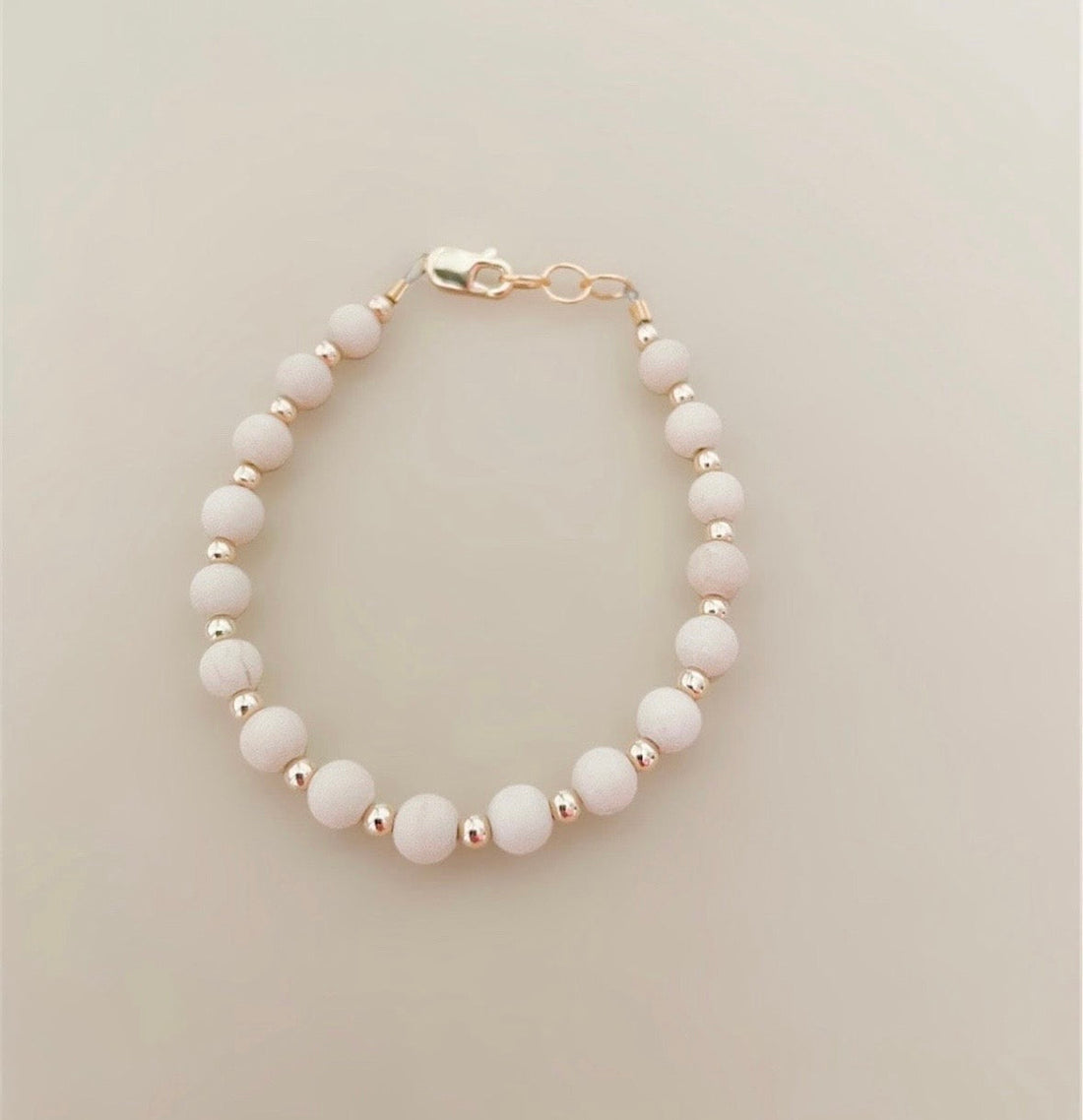 Tan &amp; gold layer bracelet
