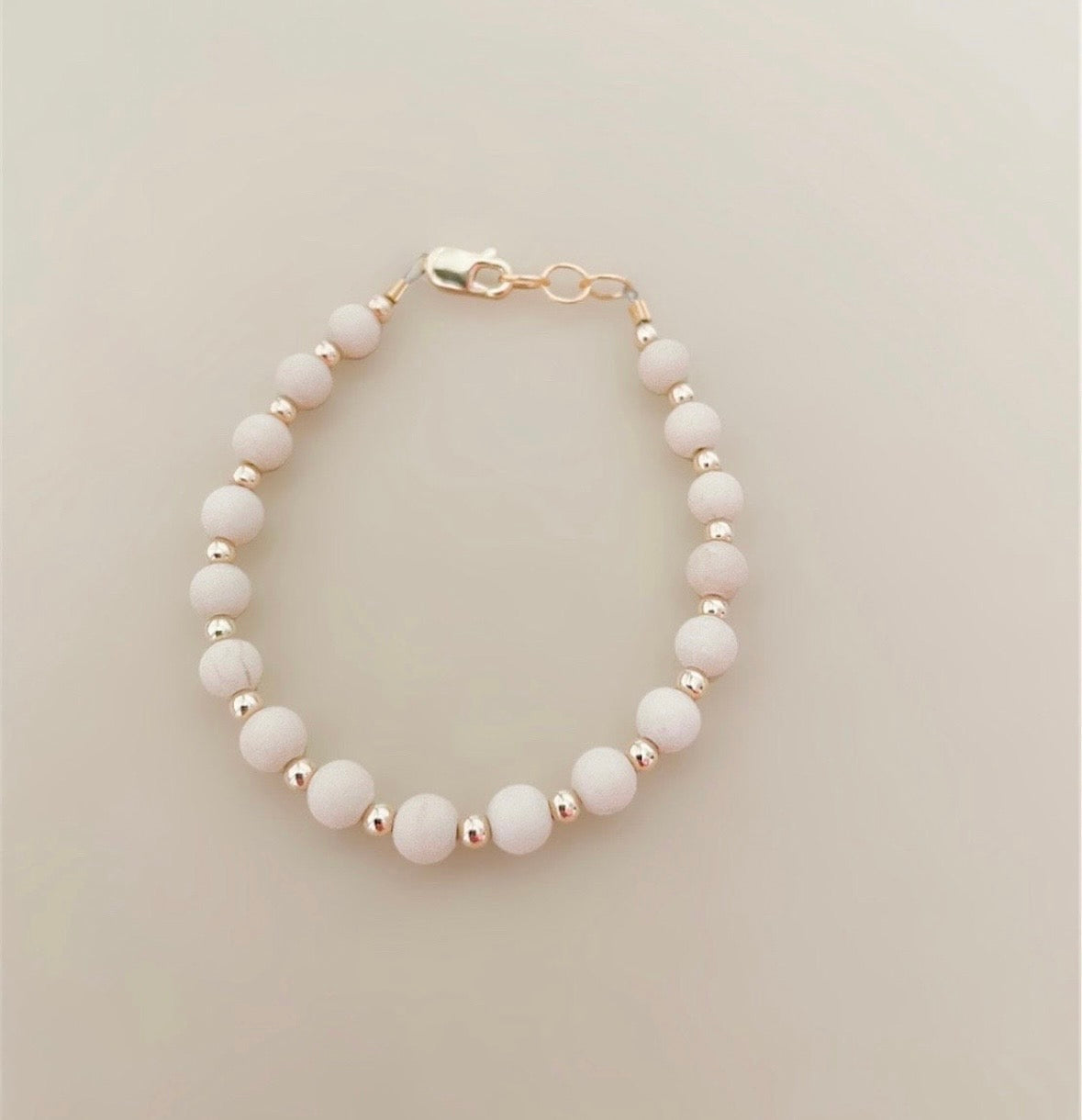 Tan &amp; gold layer bracelet