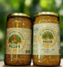 Jars of pollen on a wooden shelf with visible labels.