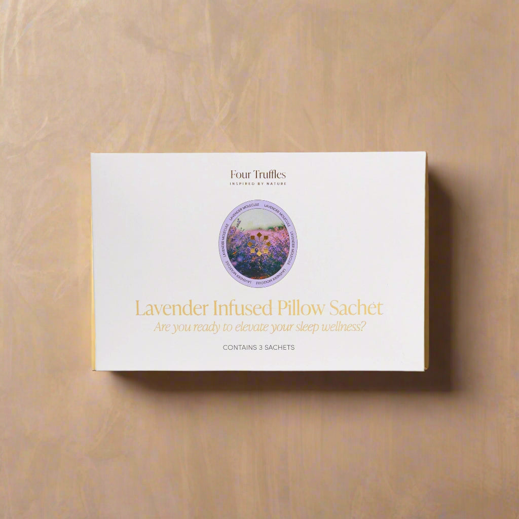 A lavender infused pillow sachet by Four Truffles with a clear window showing the product inside, labeled for enhancing sleep and relaxation.
