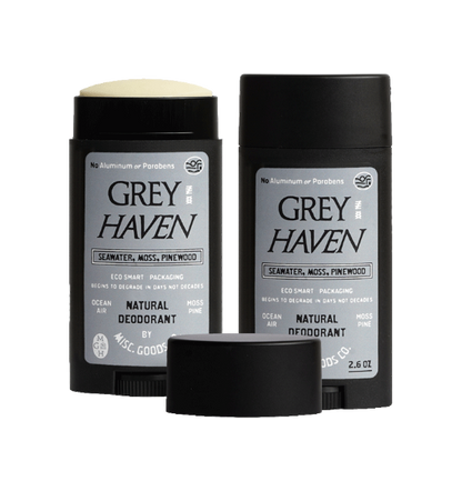 Two Grey Haven natural deodorants with black caps on a white background