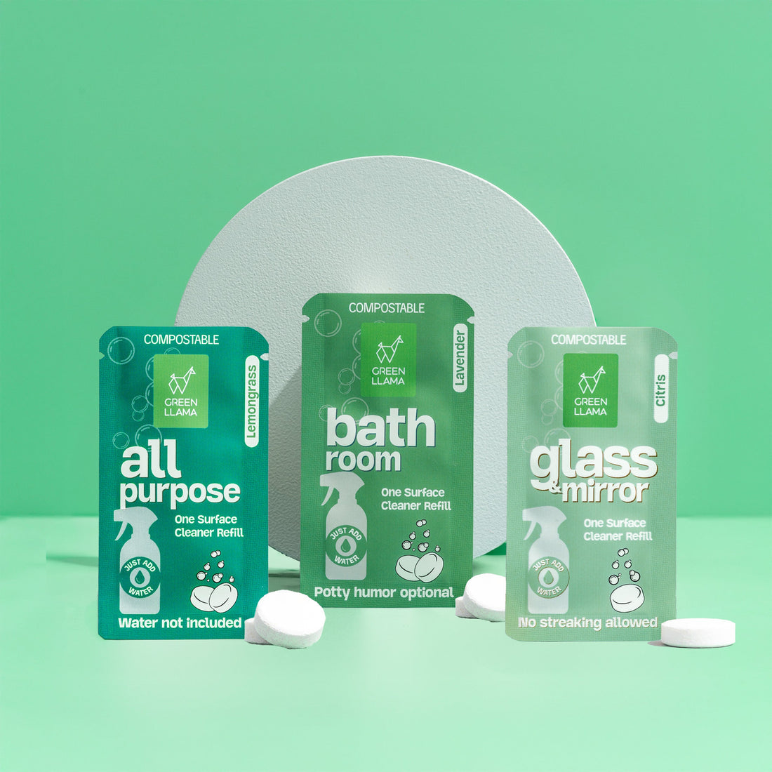 Three green packaging containers labeled &
