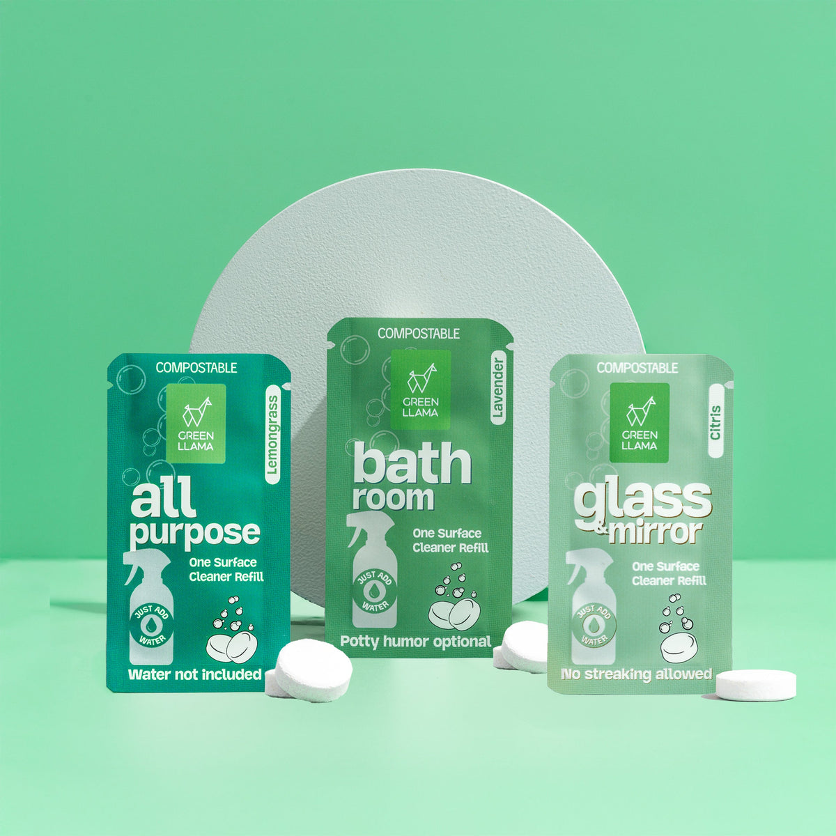 Three green packaging containers labeled &
