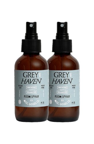 Two bottles of Grey Haven room spray on a white background
