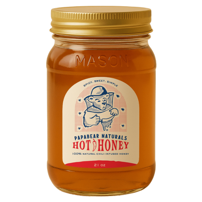 Jar of Papabear Naturals Hot Honey with a gold lid on a white background