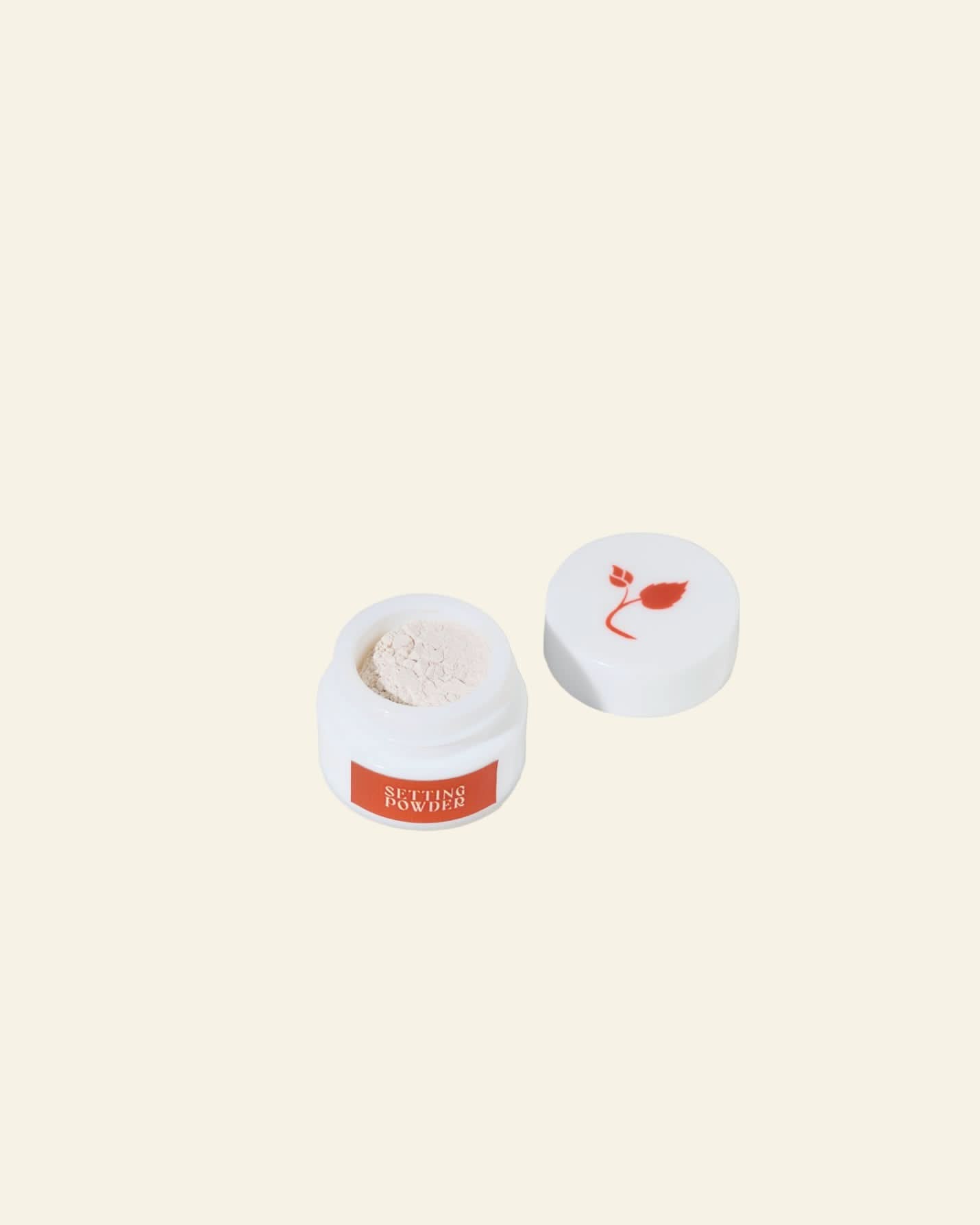 Cosmetic container with a red label and white lid on a white background