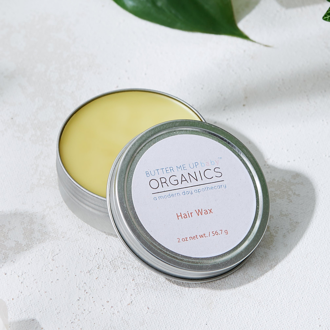 Tin of skincare product with &