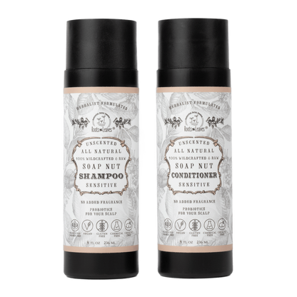 Two bottles of soap nut shampoo and conditioner on a light green background