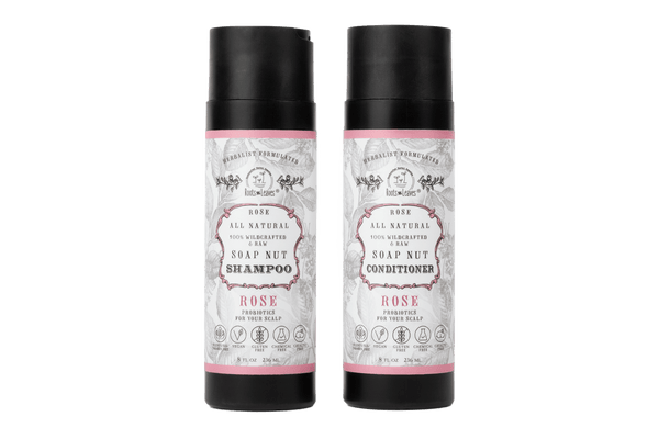 Two bottles of All-Natural Shea Nut Shampoo and Conditioner with rose scent on a white background.