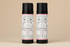 Two bottles of All-Natural Shea Nut Shampoo and Conditioner with rose scent on a white background.