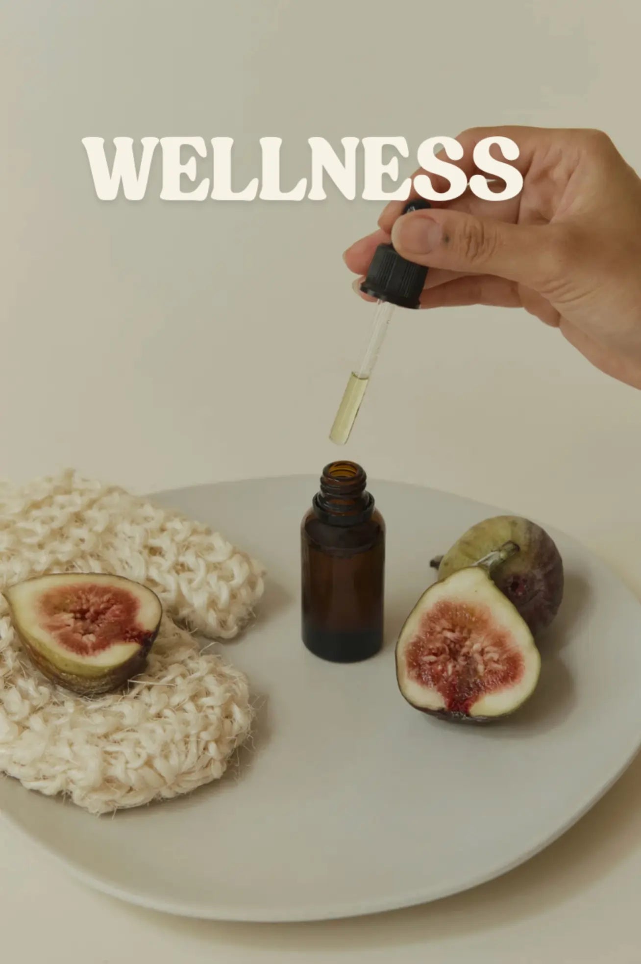 Hand holding a dropper over a bottle with figs and rice on a plate, labeled 'Wellness'.