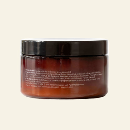 Brown jar with black lid on a white background