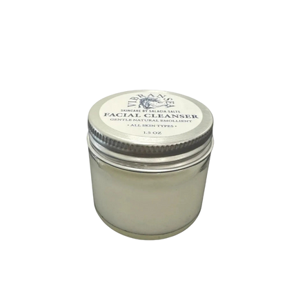 Facial cleanser jar with a metal lid on a white background