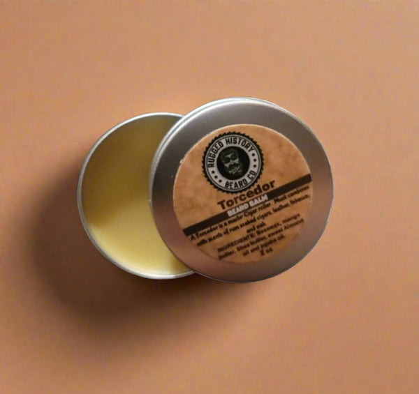 Tin of Torcedor wax with Rugged History logo on a textured surface