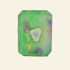 Green crystal with a triangular white stone on a reflective surface