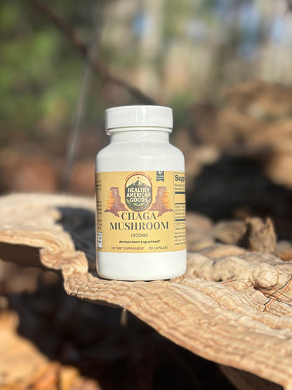 Bottle of Chaga Mushroom supplement on a wooden surface with a natural background