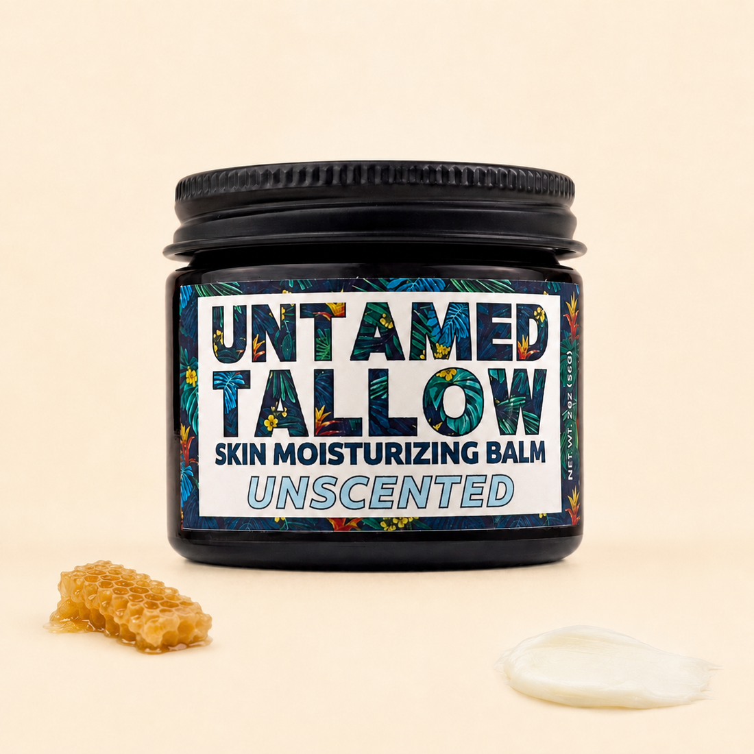 A jar of Untamed Tallow Skin Moisturizing Balm, Unscented, shown on a warm beige background with a honeycomb piece and a dollop of white balm as props.