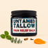 A jar of Untamed Tallow Pain Relief Balm with a black lid and a tropical patterned label, styled on a beige background with mint leaves, eucalyptus, cinnamon, cloves, and a smear of orange balm.