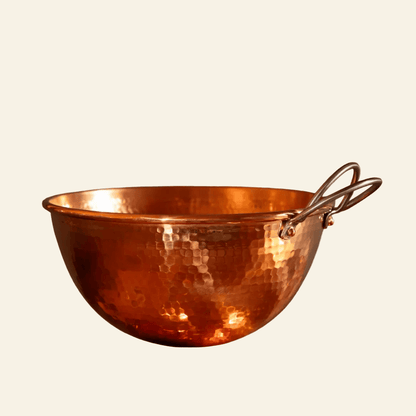 Copper bowl with a handle on a light beige background