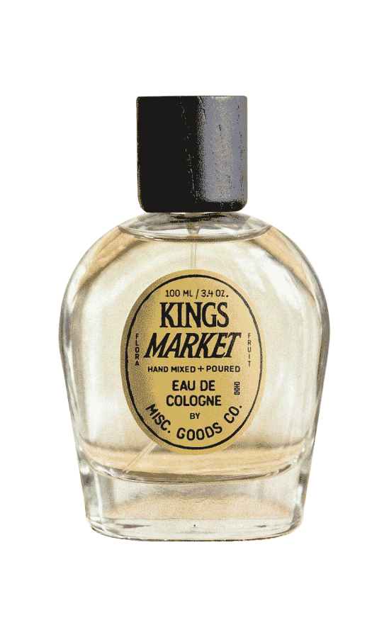Clear glass bottle of Kings Market cologne with a black cap on a white background