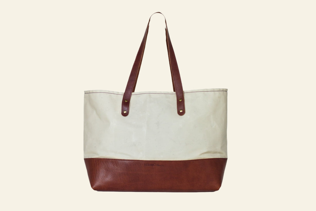 Tote bag with brown bottom half and beige top half on a white background