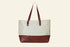 Tote bag with brown bottom half and beige top half on a white background