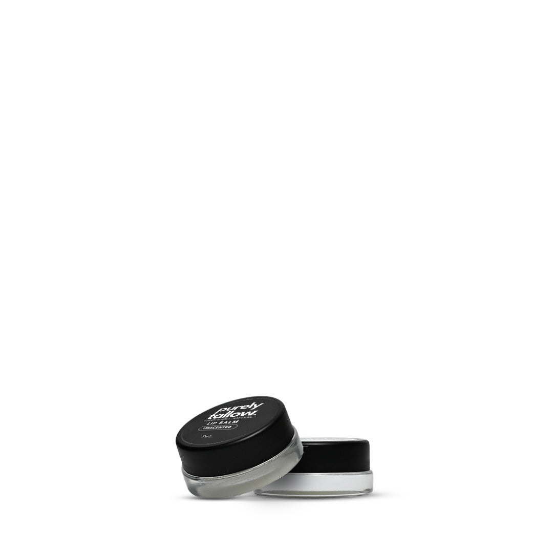 A small cosmetic jar with a black lid and clear container showing a white cream product inside, photographed on a plain white background.