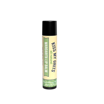 A single tube of Kiss My Grits all natural lip balm with a black cap and a cream-colored label featuring green and navy text, set against a plain white background.