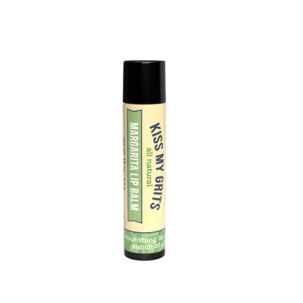 A single tube of Kiss My Grits all natural lip balm with a black cap and a cream-colored label featuring green and navy text, set against a plain white background.