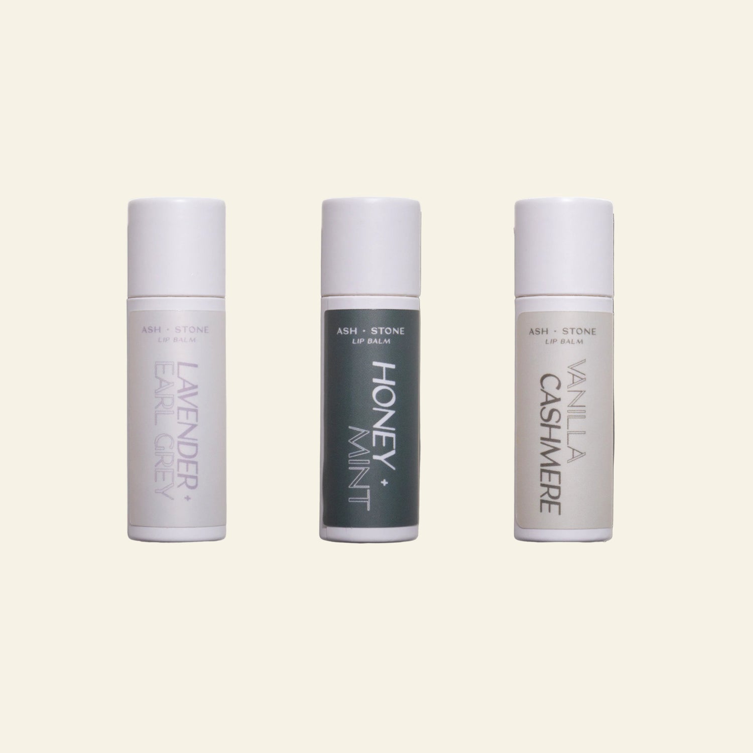 Three lip balm tubes labeled &