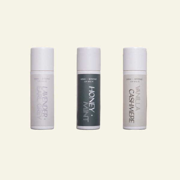 Three lip balm tubes labeled &