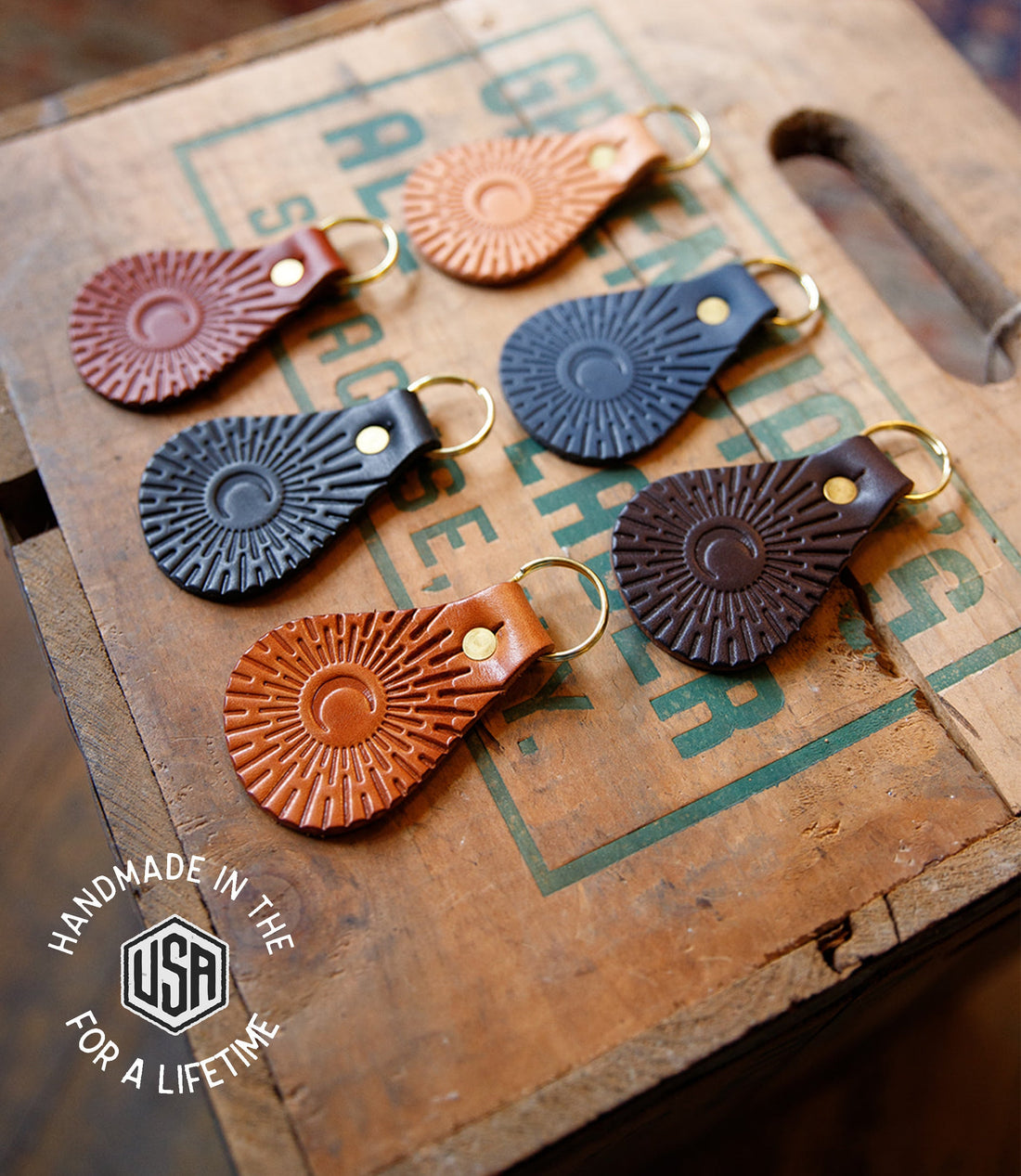 Set of leather keychains on a vintage box with &