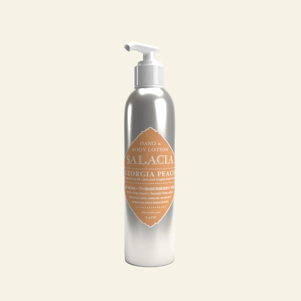 Silver lotion bottle with a label on a white background