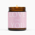 Candle with a pink label reading &