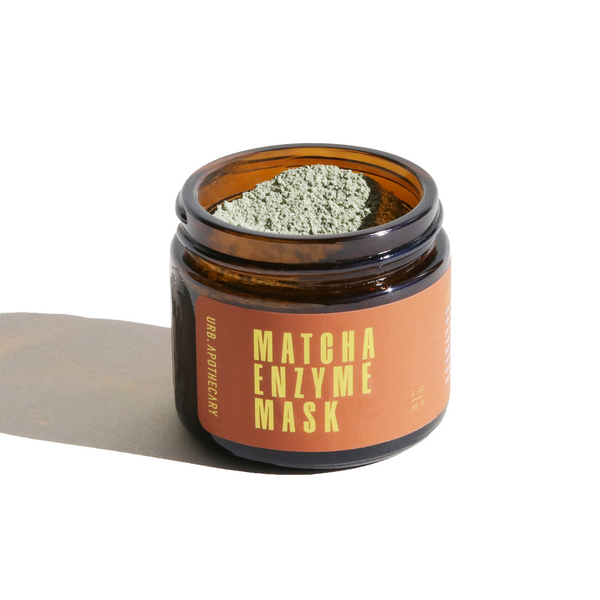 Jar of matcha enzyme mask with a label on a white background