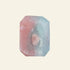 Hexagonal crystal with pink and gray colors on a light background